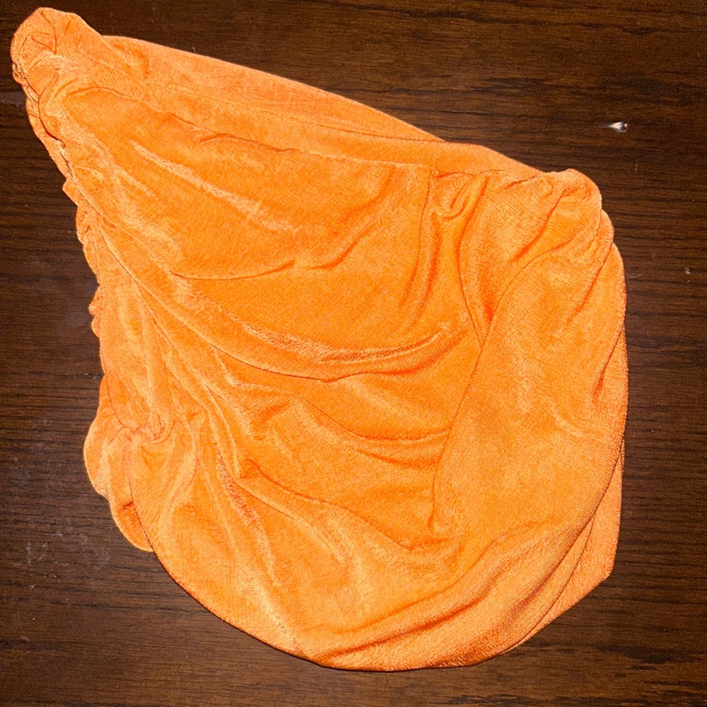 Orange shiny one-shoulder top